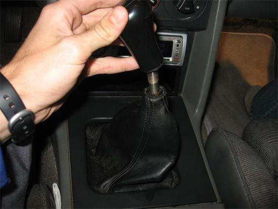1. Remove shifter knob by twisting it off. 2.