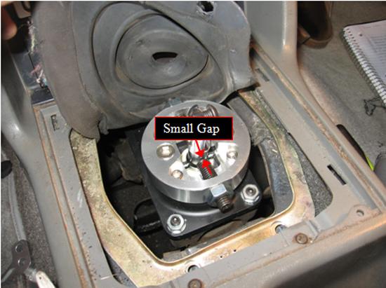Using the 6 mm Allen wrench, adjust the screws included with the kit so that when the transmission is in gear, there is