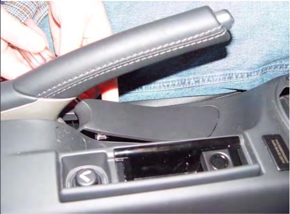 In the center console, lift up the rubber mat