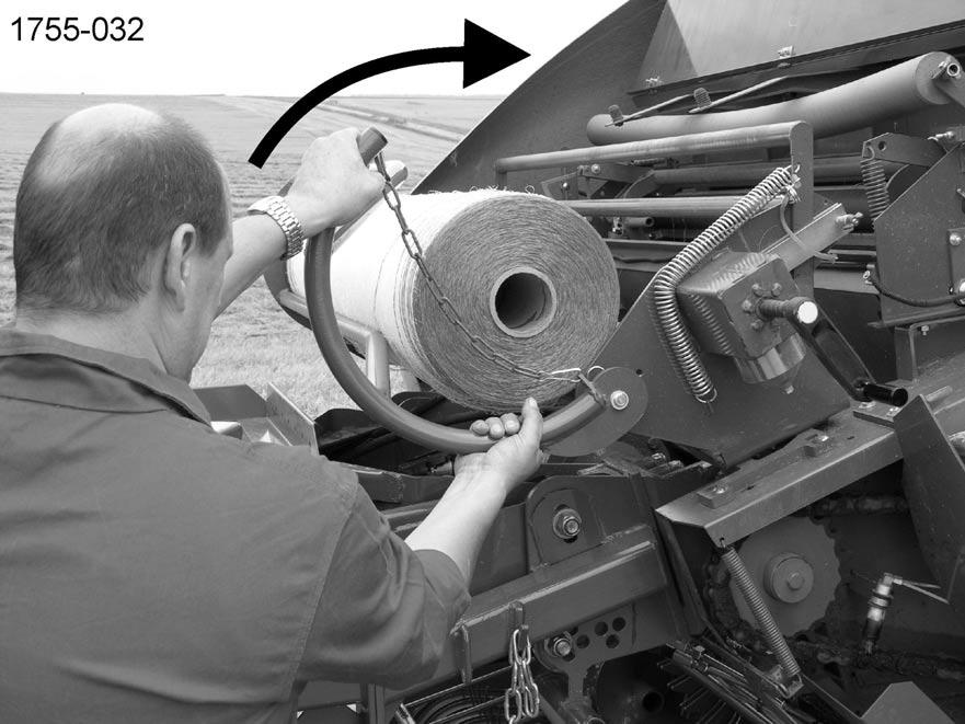 (Figure 43) Slide net roll until the lock plate into the tiltable auxiliary net holder. Note! Watch wind-off direction of the net roll!