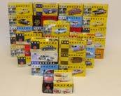 Packaged or Cased Die- Cast Models, A collection of vintage and modern commercial, private, and examples from television and film, mostly 1:43 scale vehicles, all packaged or in plastic display cases