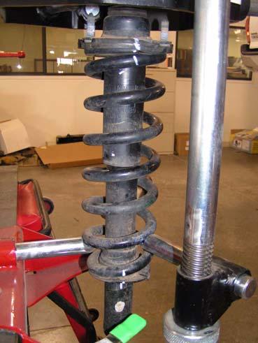 Mark strut, upper mount, and coil spring with an alignment mark to ensure proper re-assembly. Mark Install Front Suspension 1. Driver side strut assembly a.
