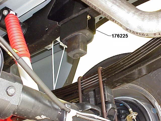 11) Bend the parking brake cable guide (attached to the frame above the rear axle) forward to relieve tension on the cable. 12) Install new Rancho shock absorbers.