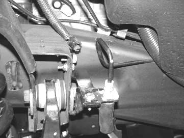 Re-route the brake hose and the ABS Line to the steering knuckle using the adel clamp to the back of the steering knuckle and attach with ¼ x 3/4 bolt and washer.