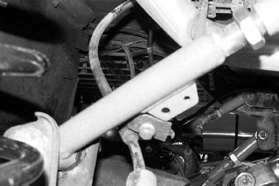 Note: Do not lock off jam at this time 85. Apply grease and install bushings (M02957RB) into arms. FIG. 12 94. Position the provided track bar relocation bracket up to the OE axle mount.