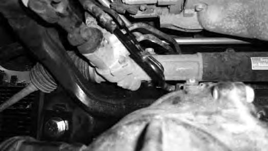Remove the differential breather tube assembly from the vehicle and bend upward to clear the steering shaft. Reinstall with factory hardware. Tighten to 15 ft-lbs.