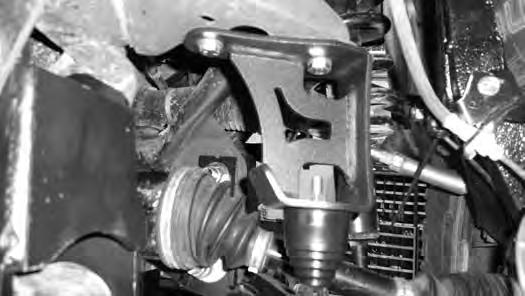 FIGURE 22 42. Attach the driveshaft to the front differential with factory hardware. Tighten to 65 ft-lbs. 43. Install the lower control arms with the factory cam assemblies. 44.