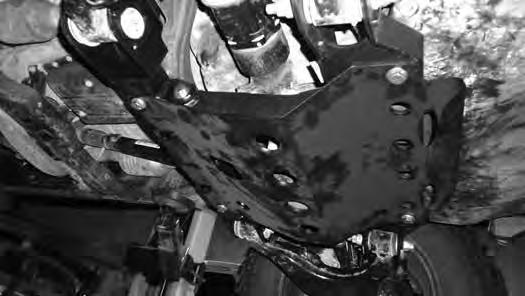 Install new cotter pin, do not loosen nut to get the cotter pin to install. 65. Double check all differential hardware for proper torque. 66. Install new skid plate with ½ x 1-1/4 bolts and washers.