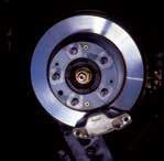) Vacuum brake booster and master cylinder located in luggage compartment.