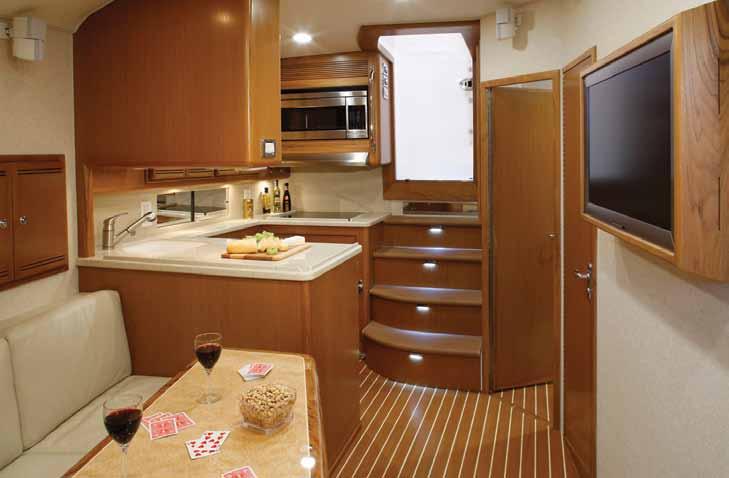 To port, a second stateroom has twin berths and a dresser.