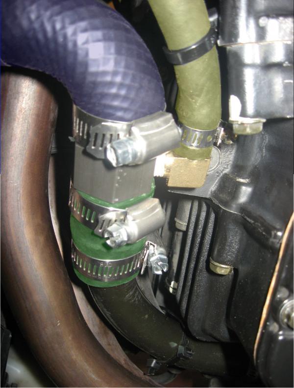Figure 8: Completed bypass tee installation. Factory radiator exit hose is shown as blue, short extention hose is shown as green, supplied bypass hose is shown as gold.
