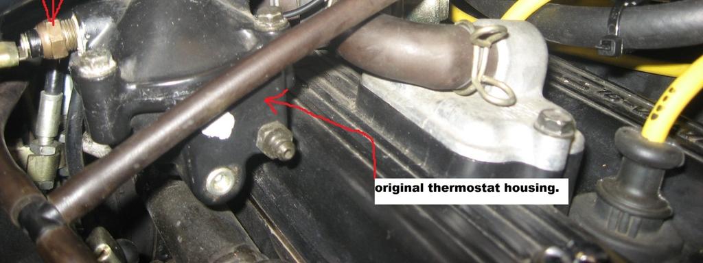 Location of original thermostat housing. STEP 5 - THERMO-BOB 1 INSTALLATION The upper radiator hose is easily accessed while the fuel tank is removed.