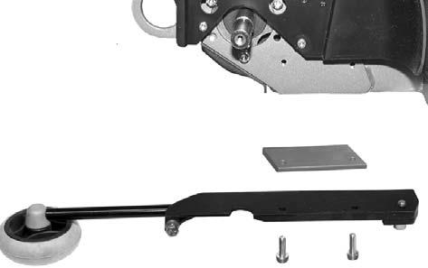 Fig. 13. Removing a support wheel. Fit the support wheel and spacer plate using the two screws, as shown in fig. 14.
