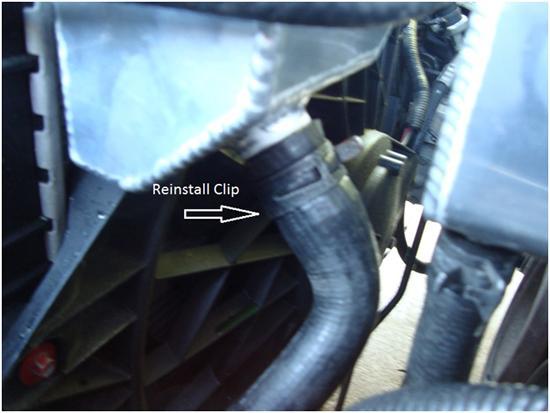 9. Reinstall lower radiator hose and clamp in place using factory spring clamp or screw style hose clamp.
