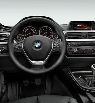 The cockpit with its centre console inclined towards the driver communicates typical BMW driver orientation.