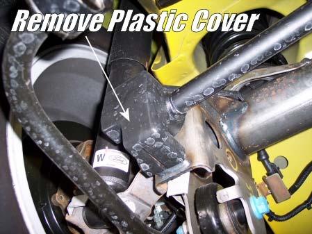 Locate the driver side panhard rod end and remove the plastic