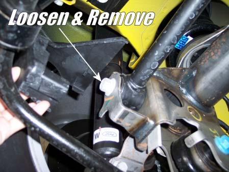 Retain stock hardware for later use. Loosen and remove bolt.
