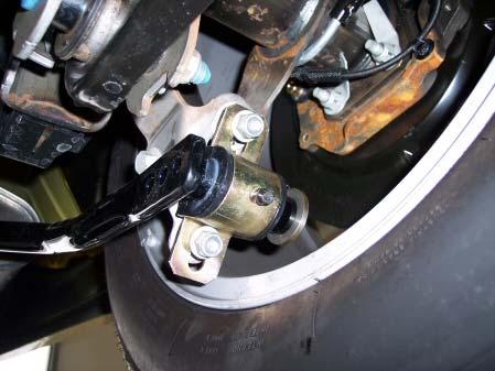 10R Install Axle Mounts Using the same stock nuts, install the
