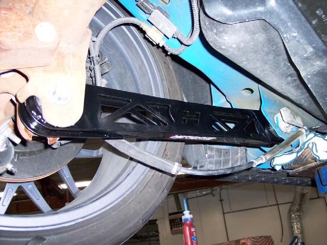 If necessary, clean mating surfaces that are on the car with an abrasive. 6) Install new Hotchkis Lower Trailing Arm.