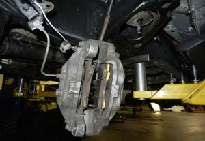 (Fig 2) Remove the ABS line from the upper control arm and knuckle. Discard the factory brackets.