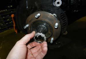 (Fig 10) Loosen but do not remove the upper ball joint nut. Strike the ball joint boss with a hammer to dislodge the taper.