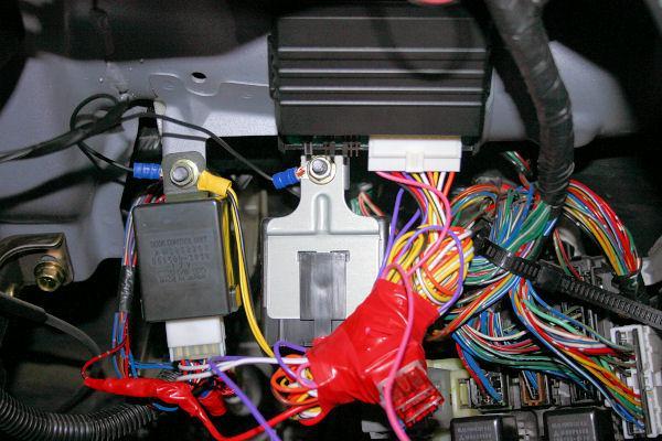 KEYLESS ENTRY UNIT ABOVE THE FUSE/RELAY BOX, AS BELOW. MAKE SURE THE ANTENNA AERIAL IS STRETCHED OUT STRAIGHT. 12. REMOVE YOUR STEREO SURROUND. BE CAREFUL NOT TO BREAK THIS AS THEY ARE VERY FRAGILE.