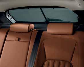 With a leather covered top, it is held in place by the center seat belt and powered from the rear auxiliary socket.