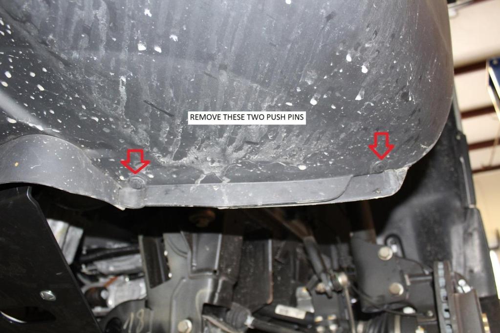 17) Remove the front inner fender well liner by first removing the two push pins located