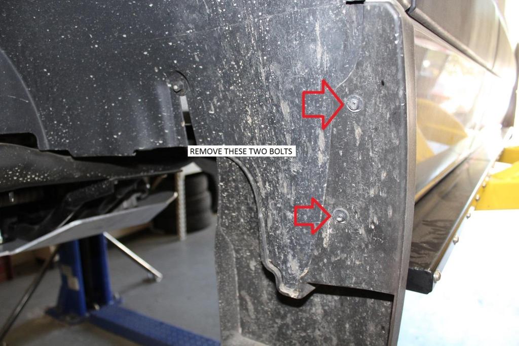 30) Pull the mudflap out away from the body so the inner fender well liner can be