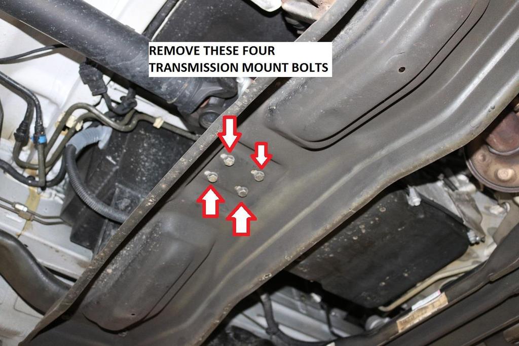 37) Remove the four transmission mount bolts shown below.