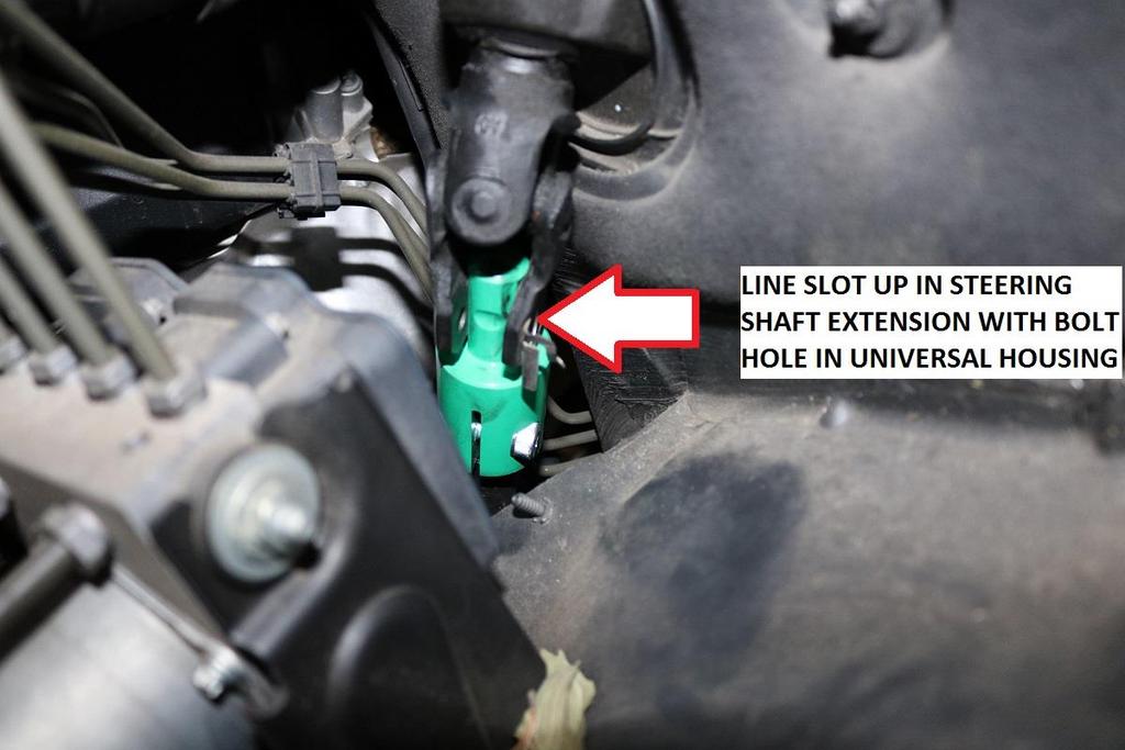 78) Install the steering shaft onto the splines of the rack and pinion. Be careful not to damage the plastic alignment tab on the splines. Once fitted, install the T-45 torx bolt removed in step 9.