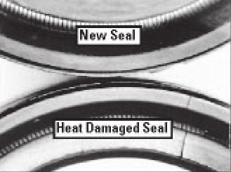 If the seal is stiff and brittle, and not pliable like the new seal, it is probably heat