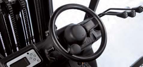 The warning horn button is located on the steering wheel per automotive convention.