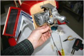 Connect the throttle linkage and make sure it is working in the proper direction and operates the carburetor linkage properly.