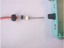 Loosen the cap nuts from the fieldbus junction box and push it onto the cable.