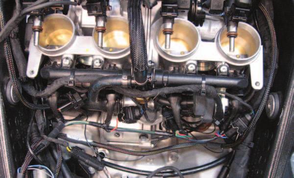 18 Lift the airbox up and out of place enough to be able to access the coils beneath it (Fig. H). FIG.
