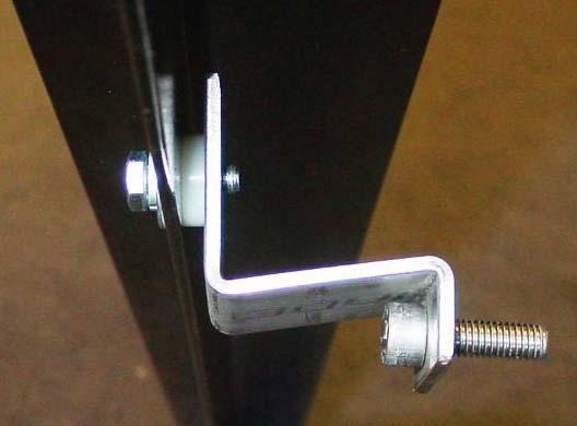 Use a rail bolt with lock washer and flat washer and insert through hole in RETRAX rail then use 1 white nylon washer between the rail and rail bracket.