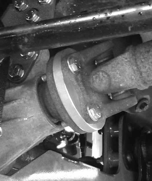 Loosely attach the knuckle to the upper control arm ball joint with the original nut. Push the CV axle all the way onto the differential output to seat the internal retaining clip. 51.