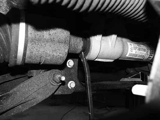Figure 6 17. Remove the upper and lower ball joint nuts. Reinstall the nuts a few turns by hand. Separate the upper and lower ball joints from the steering knuckle using the appropriate puller.