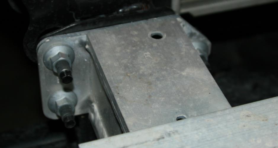 M. Using a 14mm socket, remove six bolts holding the inner bumper support.