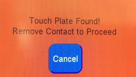 You will receive this confirmation while the plate is touching the bit.