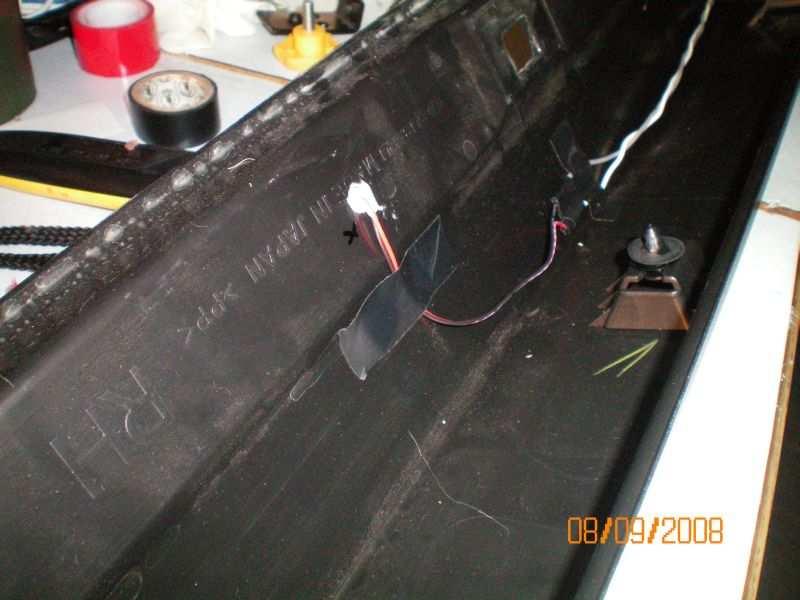 6. Place the wires in the rocker panel and route them toward the