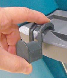 clip and carefully pull the latch tab downward
