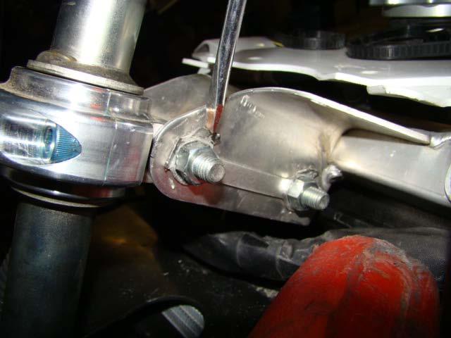 Step 13 Reinstall headlight stay using 4 OEM plastic rivets.