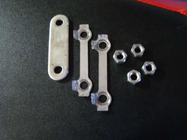 Remove nuts from the studs; remove nut retainer and bearing retainer