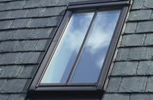 Consult your local conservation officer and find out if you can create a traditional appearance by adding a glazing bar to a standard VELUX roof window with grey exterior.