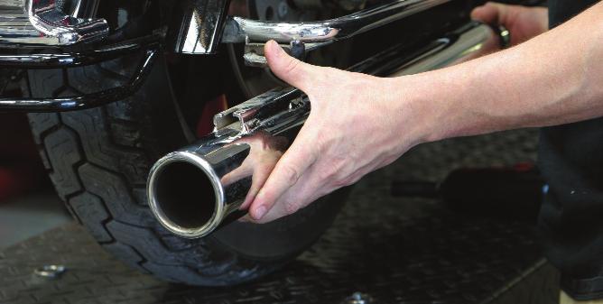 With both the slip-on mufflers loose, remove them from the