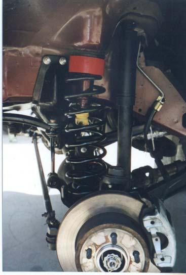 front of the rear lift springs and lower down onto the jack stands, with the floor jack under the
