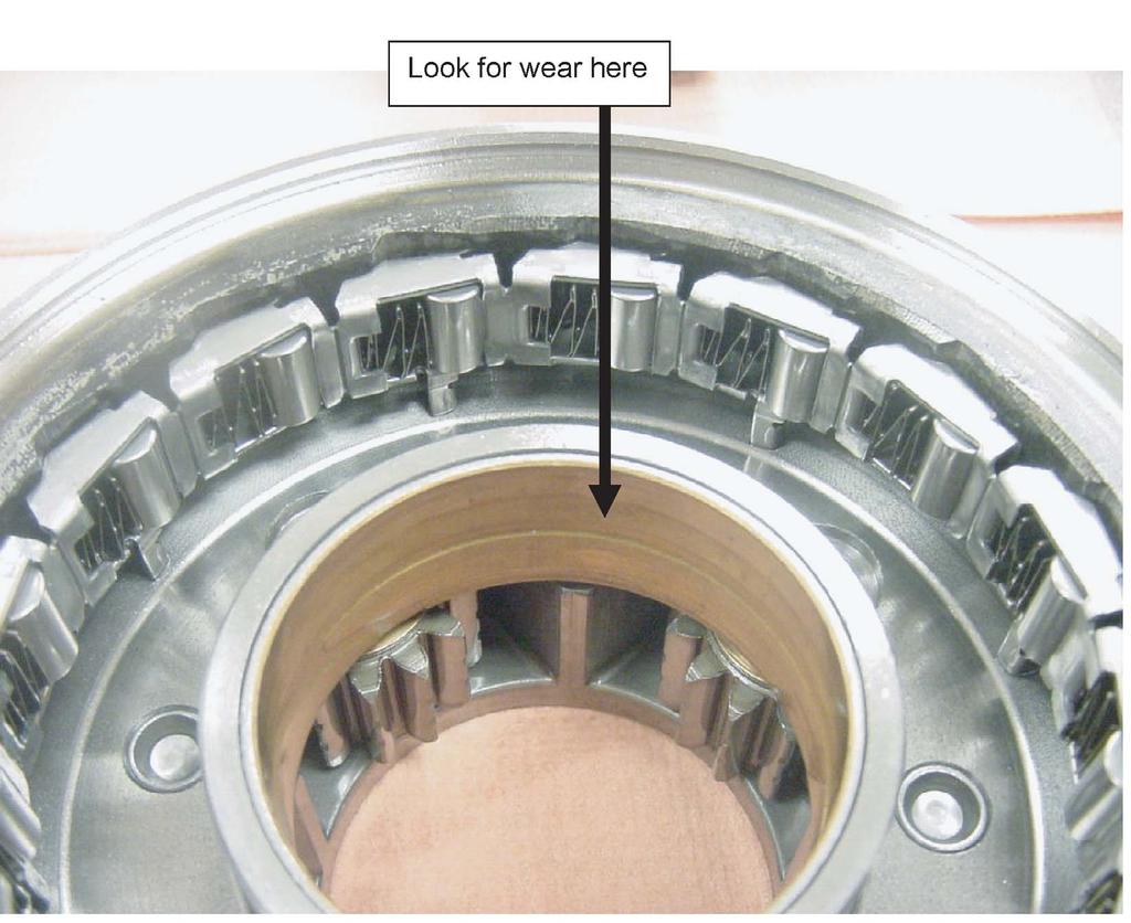 The bushing shown in the picture below is responsible for properly aligning the carrier assembly as it spins.