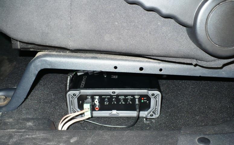 The excess wire for the Bass Controller can be wound up and placed as shown without affecting the carpet.